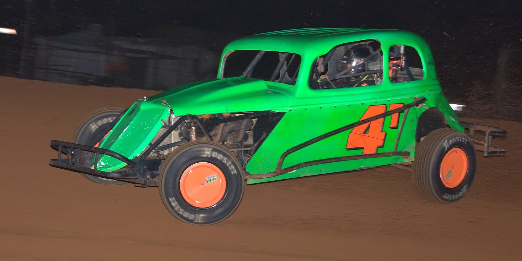 Green number 4 dirt modified on track at night